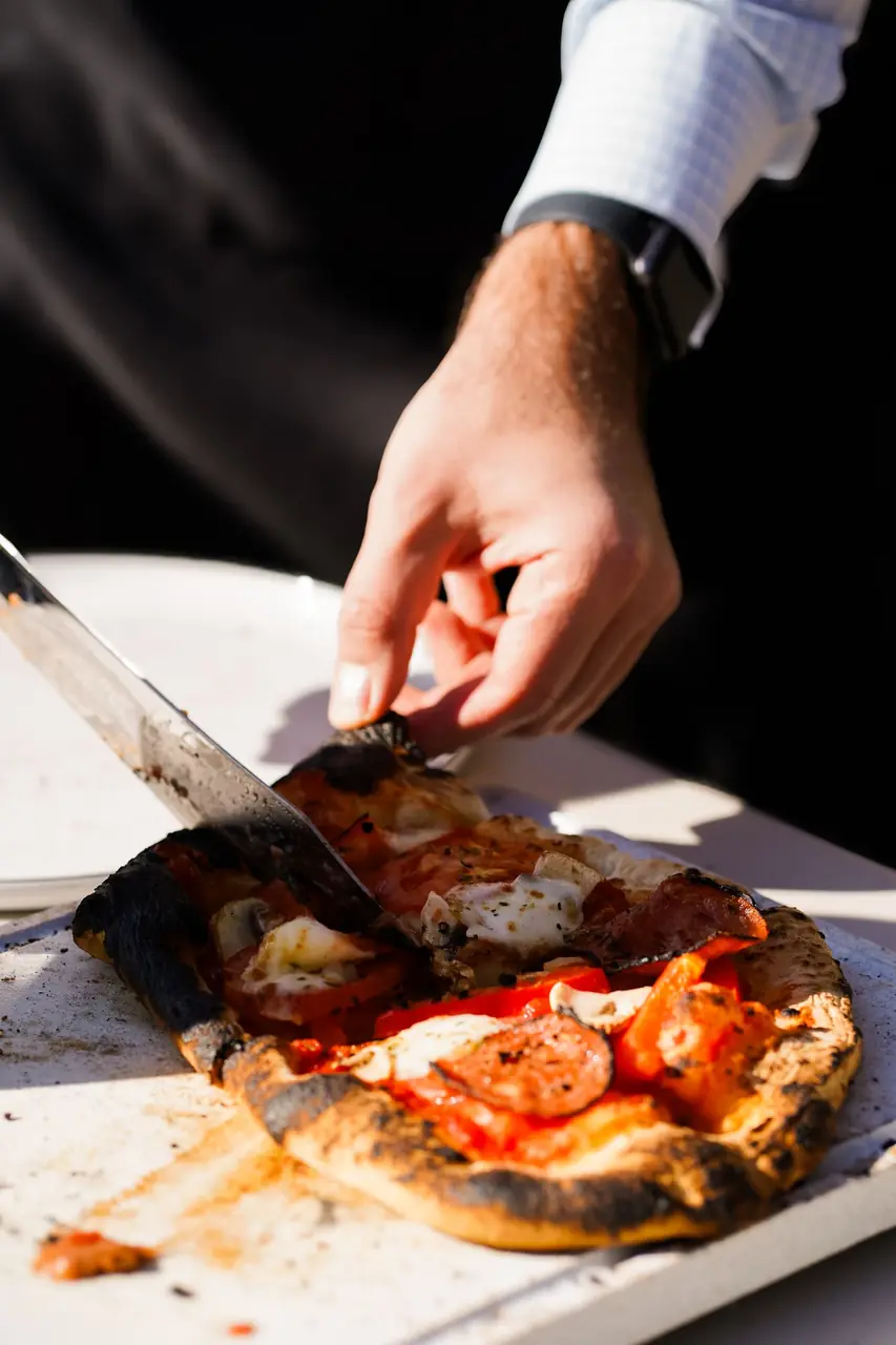 Slicing artisan pizza