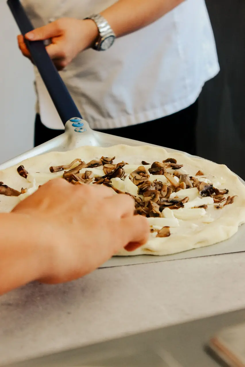 Chef preparing pizza