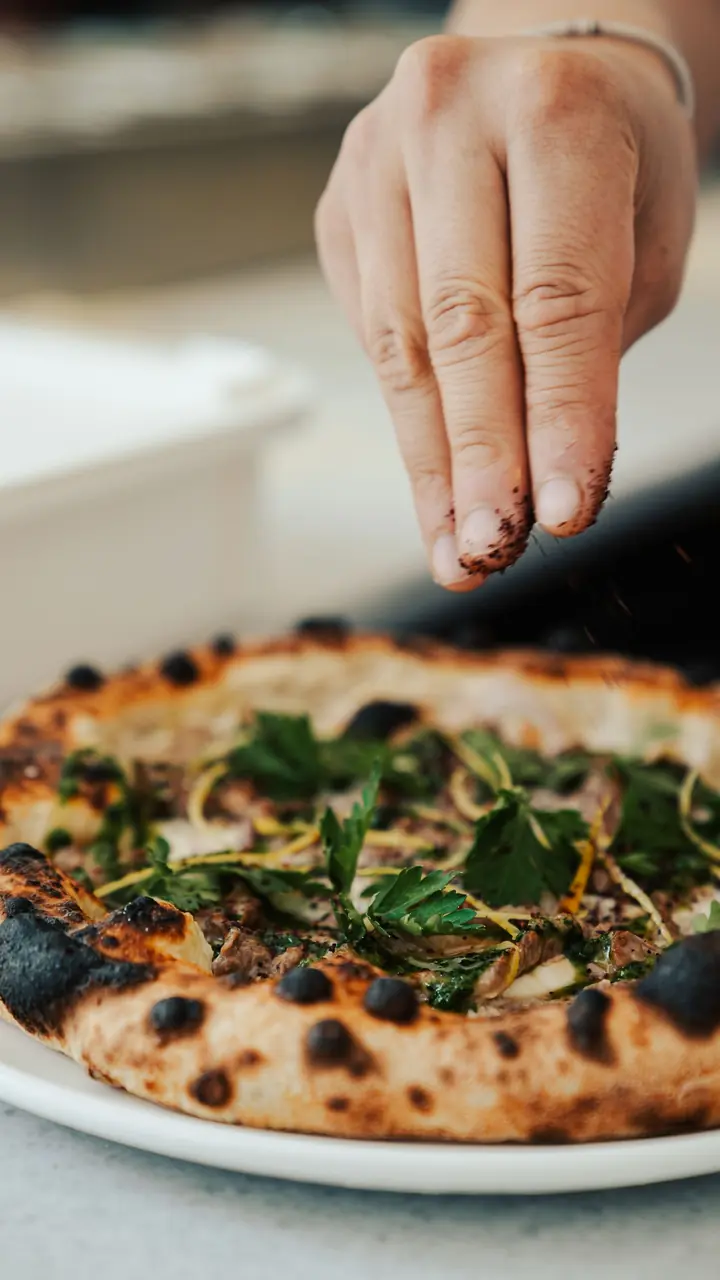 Chef preparing event pizzas