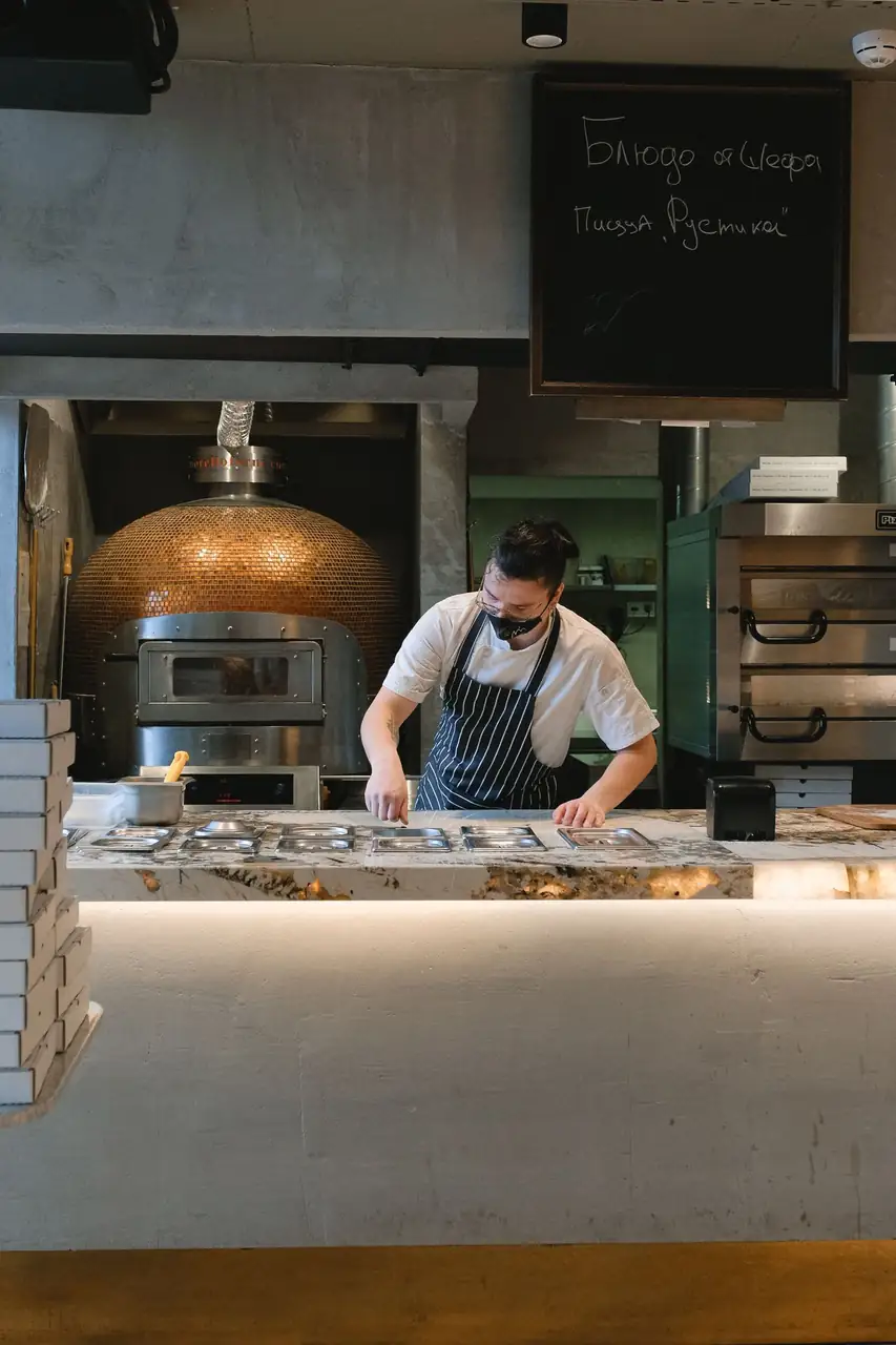 Chef preparing fresh pizza dough